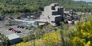 Raw coal from an onsite underground mine is conveyed to the coal preparation plant where advanced technology is used to separate coal from sulfide and rock waste. The waste is disposed of in the adjacent constructed waste pile. coal-preparation-plant