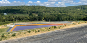 Leachate collection system directs concentrated acid mine drainage to permitted treatment facilities. leachate-collection-system
